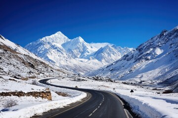 Scenic mountain highway with snow and sky