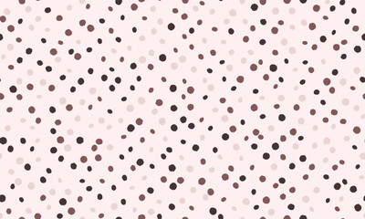 Abstract pastel pink background with scattered dots in varying shades of brown and black.  Perfect for textile design, website banners, or playful branding.