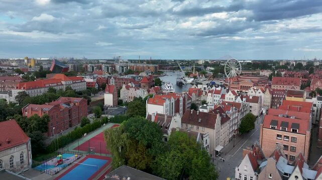 Aerial Gdansk Poland city to river front 2 4K. Baltic coast of northern Poland. World War II started here with German invasion. Economic international port. Historical buildings, tourism.