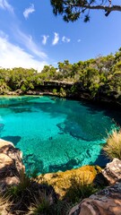 Lush turquoise pool nestled in a natural rocky cove