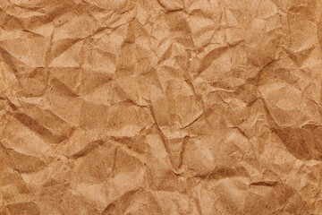 Brown crumpled recycled paper texture, blank template wrinkly background with space for text