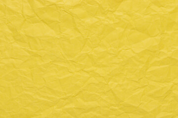 Banana yellow color crumpled paper texture, blank template wrinkly background with copy space
