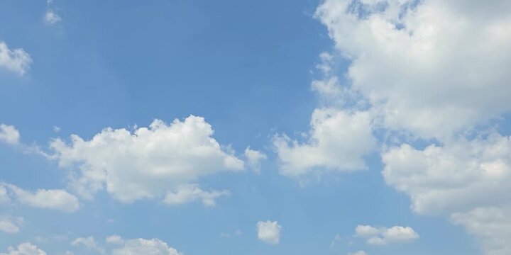 Cloudscape, Timelapse of a beautiful Blue sky with scattered white clouds in daylight, for a background	
