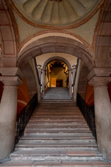 Grand stone staircase with arched doorway and dome ceiling inside Regional Museum in Queretaro, Mexico