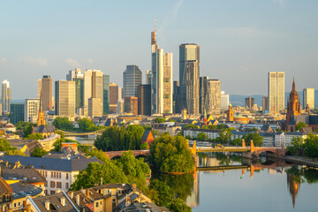 Naklejka premium Frankfurt City Skyline, Residential Buildings, Bridges and Main River on Sunny Morning. Aerial View. Golden Hour. Hesse, Germany