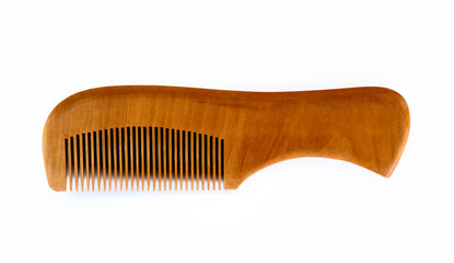 Wooden comb resting on white background for hair care