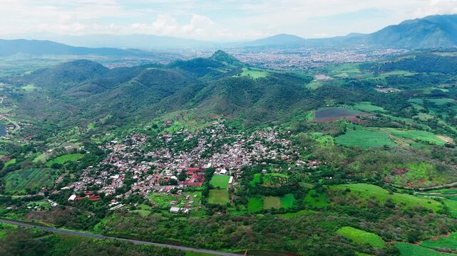 Aerial view of bellavista, nayarit, a charming village surrounded by lush vegetation and rolling mountains, showcasing the beauty of rural mexico