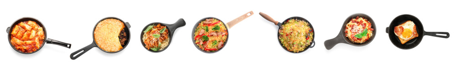 Set of frying pans with different cooked dishes on white background, top view