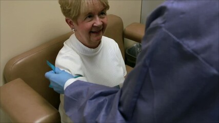 Older Woman Getting Blood Draw in Hospital Laboratory