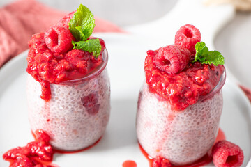 Two jars of homemade raspberry chia pudding