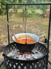 Hungarian goulash cooking on an open fire