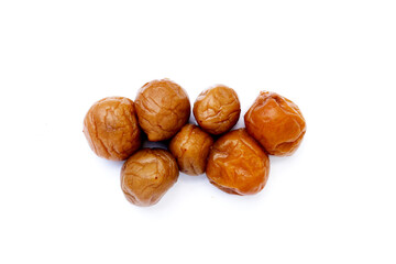 Pickled plums on white background.