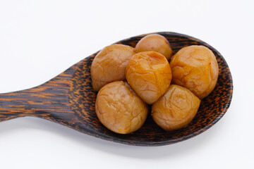 Pickled plums on white background.