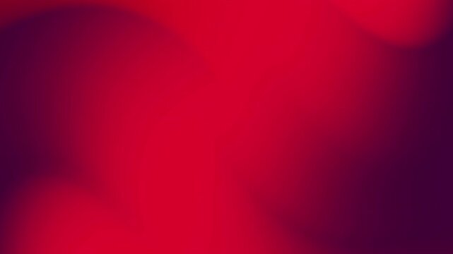 A blurred gradient image in deep crimson and dark purple