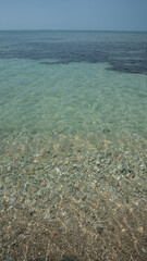 Isla de Enmedio, Veracruz. Pristine sandy beach and turquoise sea under clear blue sky in Mexico.