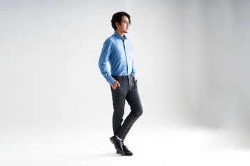 An Asian man in a blue shirt