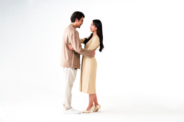 Asian men and women hugging and holding hands before the Spring Festival