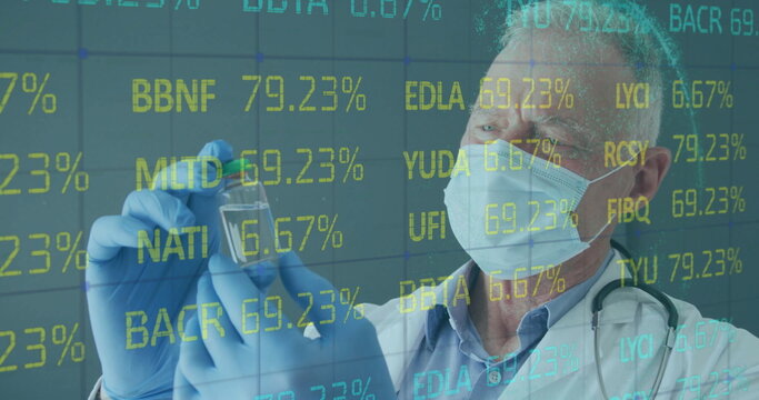 Examining doctor wearing mask, nitrile gloves and stethoscope holding vial in lab, with ticker data
