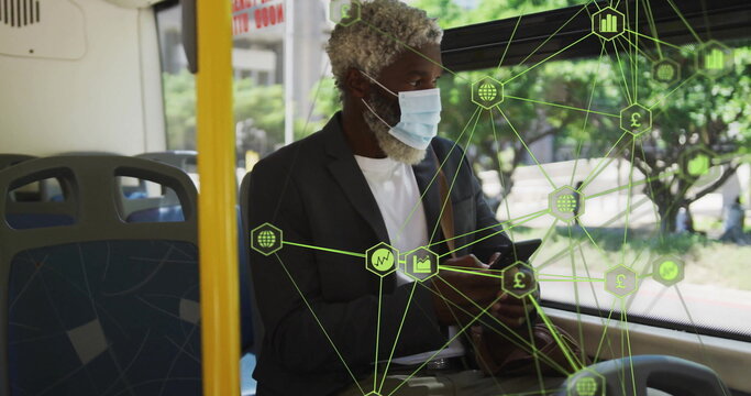 Business man wearing mask and blazer checking smartphone on bus, with financial network overlay