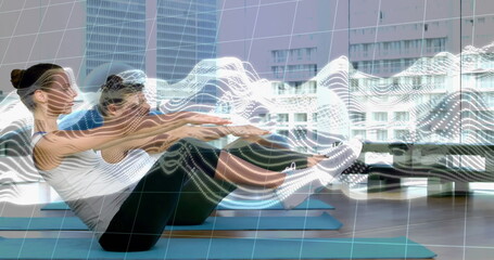 Balancing on blue mats three adults in athletic shoes lifting legs at gym, motion tracking overlays