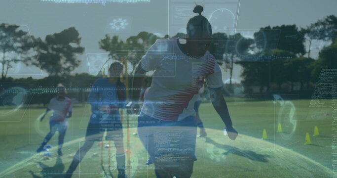 Dribbling African American woman in red jersey guiding soccer ball on field with digital graphics - Powered by Adobe