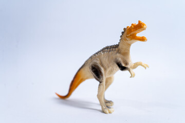 Majungasaurus dinosaur toy roaring on white background