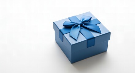 Obraz premium Blue gift box with a bow, isolated on white background with copy space, perfect for copyspace