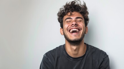 Obraz premium Young Brazilian man isolated on white background laughing