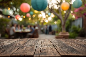 Rustic Wooden Table with Blurred Garden Party Background and Colorful Lanterns
