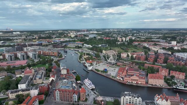Aerial Gdansk Poland river to city pull 2 4K. Baltic coast of northern Poland. World War II started here with German invasion. Economic international port. Historical buildings, tourism.