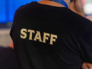 Staff Member Wearing Identification T-Shirt at Event
