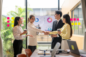 Business people shaking hands during meeting in office