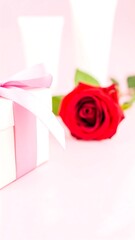 Gift with rose on pink