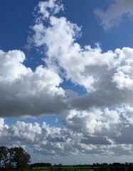 Obraz premium Cloudy Sky Over Rural Landscape