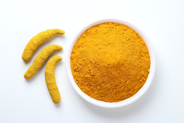 Indian spice called turmeric roots and powder isolated on white background 