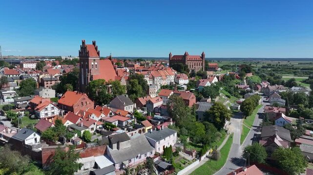 Aerial Gniew Poland historic brick castle and church 1. Northern Poland. Castle construction 13th century by Teutonic Knights. Vistula River. Agriculture land, river, forest and farm rural area.