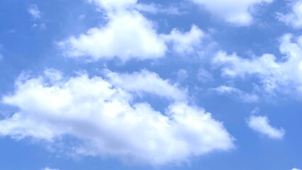 Fototapeta premium Fluffy cumulus clouds with sunlight in blue sky for background or illustration 