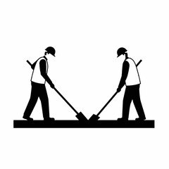 Two silhouetted construction workers wearing hard hats and safety vests are diligently digging or paving a surface with shovels, representing teamwork and labor.