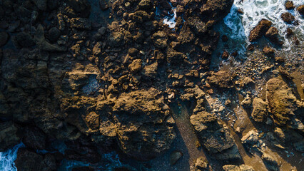 Aerial Photo of Karang Agung Rocky Beach at Sunset, Beautiful Coastal Texture from Above, UNESCO Global Geopark Kebumen