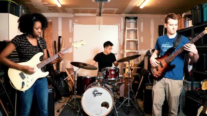Young musicians performing in a garage, showcasing their skills with instruments and energy