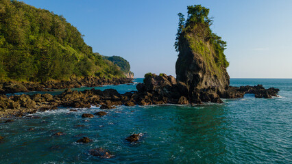 Obraz premium Aerial Photo of Karang Agung Rocky Beach at Sunset, Beautiful Coastal Texture from Above, UNESCO Global Geopark Kebumen