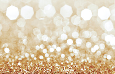 Golden glitter background with sparkling bokeh lights