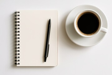 White notebook with pen and coffee cup flat lay