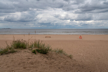 A deserted sandy beach on the Baltic Sea coast on a sunny summer day, Sestroretsk, Kurortny District, Saint Petersburg, Russia