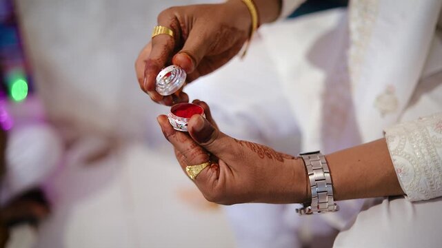 Ceremony of Wearing Turmeric Thread on hand of bride. Marathi Wedding Ceremony. Maharashtra Culture. Hindu wedding rituals and ceremony