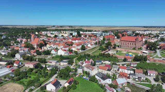 Aerial Gniew Poland historic village and castle arch. Northern Poland. Castle construction 13th century by Teutonic Knights. Vistula River. Agriculture land, river, forest and farm rural area.