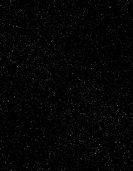 Black speckled surface texture detail close-up