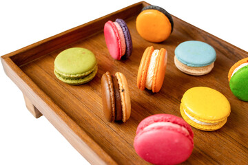 Colorful Macarons Delight: A mouthwatering assortment of vibrant macarons arranged artfully on a warm wooden tray, an image that captures the essence of the world of indulgence and confection.