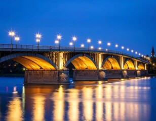 Naklejka premium Illuminated bridge at twilight over calm river
