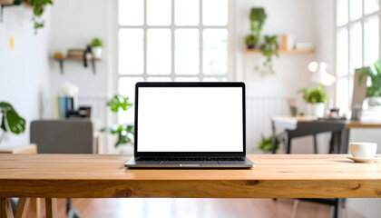 Laptop on wooden table in modern office setting